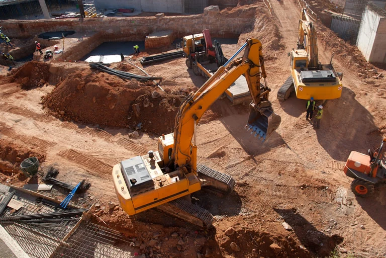Construction & Development - Heavy Machinery Digging on Site